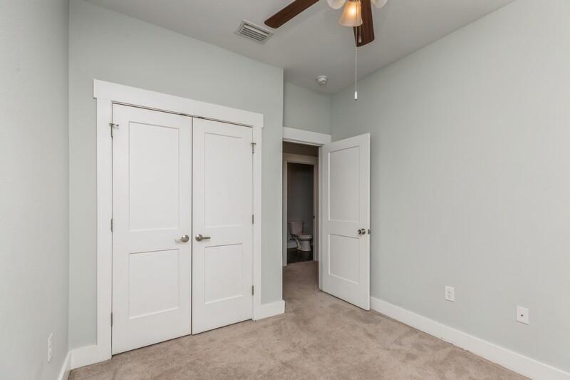 151 North Sand Palm Road, Unit 151 Freeport, FL 32439 - Photo 17 of 35 an empty room with chandelier fan