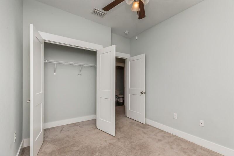 151 North Sand Palm Road, Unit 151 Freeport, FL 32439 - Photo 18 of 35 an empty room with chandelier fan