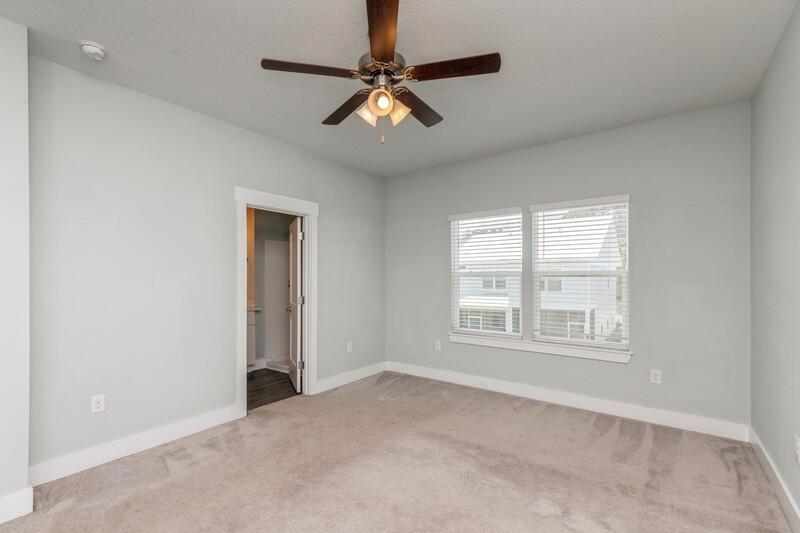 151 North Sand Palm Road, Unit 151 Freeport, FL 32439 - Photo 20 of 35 an empty room with windows and fan