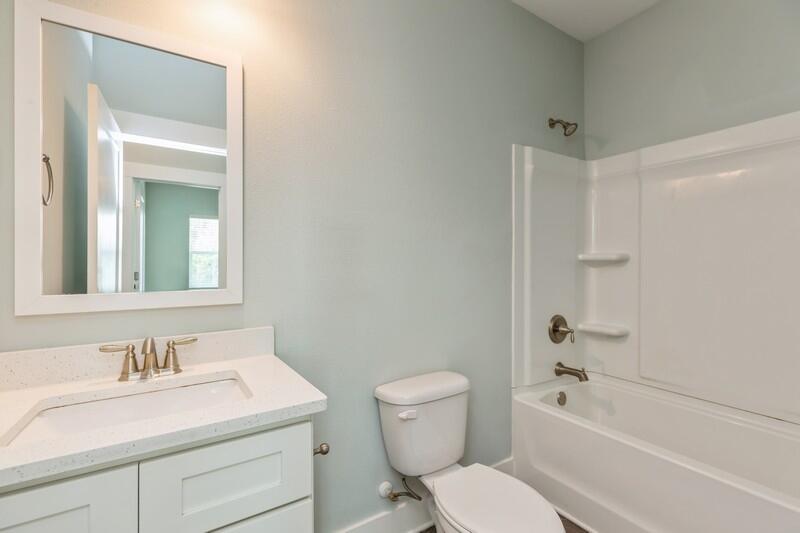 151 North Sand Palm Road, Unit 151 Freeport, FL 32439 - Photo 21 of 35 a bathroom with a granite countertop toilet a sink and a bathtub
