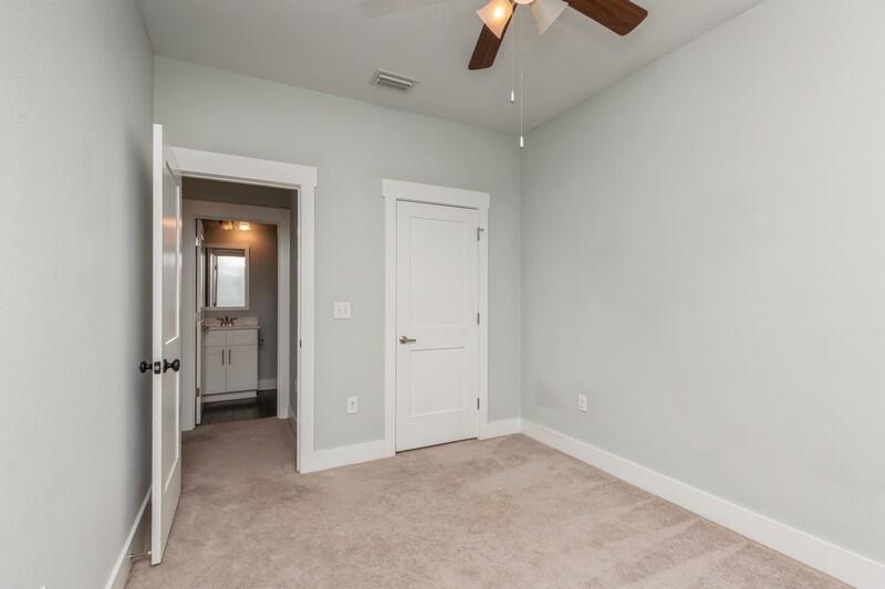 151 North Sand Palm Road, Unit 151 Freeport, FL 32439 - Photo 23 of 35 an empty room with chandelier fan