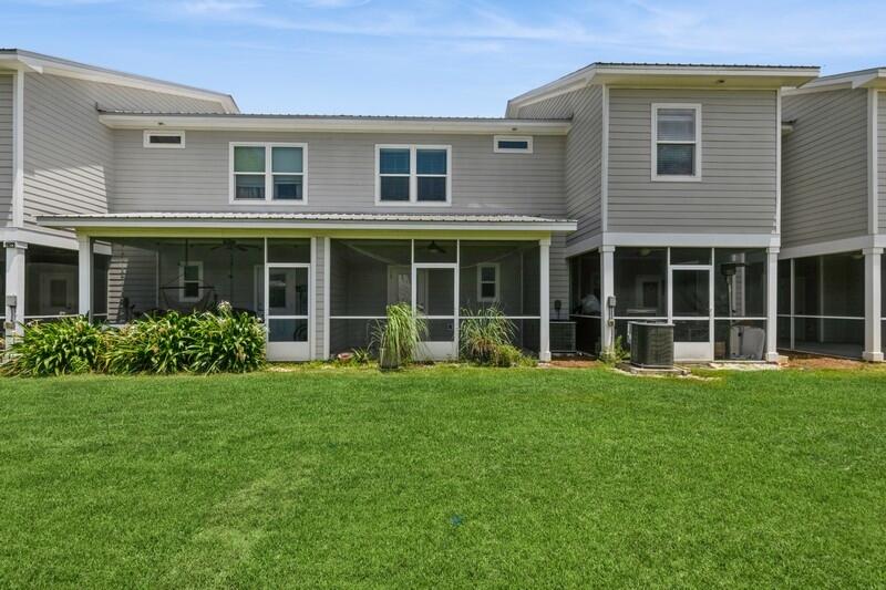 151 North Sand Palm Road, Unit 151 Freeport, FL 32439 - Photo 27 of 35 a view of a house that has a garden