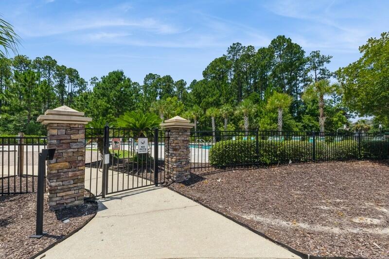 151 North Sand Palm Road, Unit 151 Freeport, FL 32439 - Photo 31 of 35 a view of a backyard with a garden