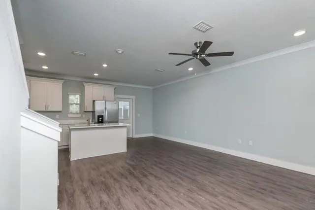 a view of kitchen with sink microwave and stove