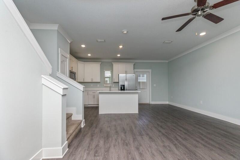 151 North Sand Palm Road, Unit 151 Freeport, FL 32439 - Photo 7 of 35 a view of kitchen with cabinets and wooden floor