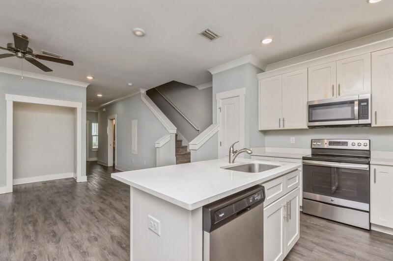151 North Sand Palm Road, Unit 151 Freeport, FL 32439 - Photo 10 of 35 a kitchen with a sink appliances and cabinets