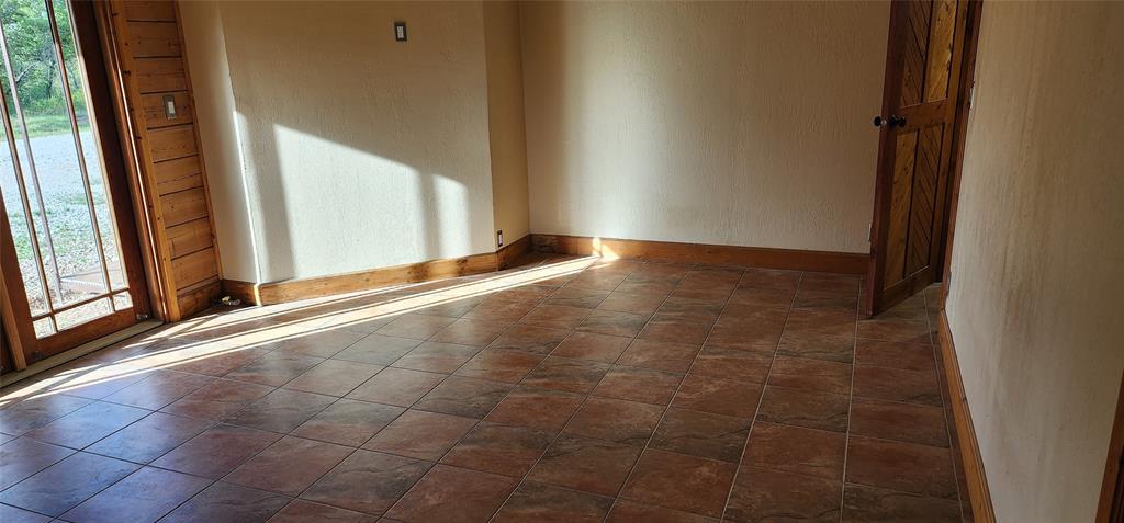 1992 County Road 330 Ranger, TX 76470 - Photo 16 of 40 a view of an empty room and window