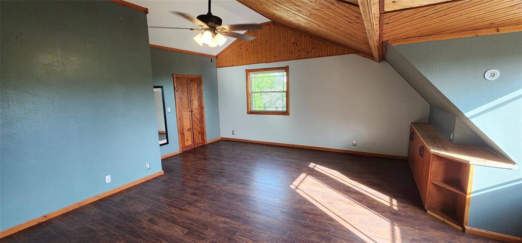 1992 County Road 330 Ranger, TX 76470 - Photo 25 of 40 a view of empty room with wooden floor
