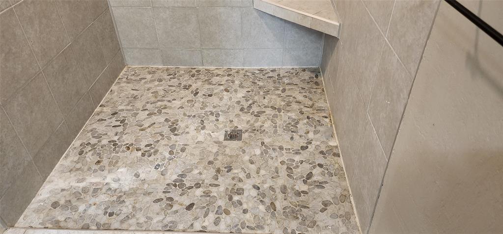 1992 County Road 330 Ranger, TX 76470 - Photo 30 of 40 a bathroom with a shower curtain