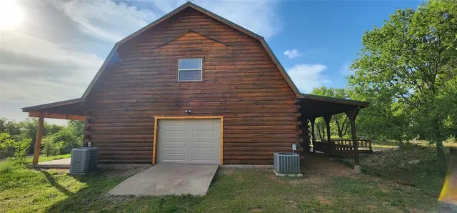 a backyard of a house with barbeque oven