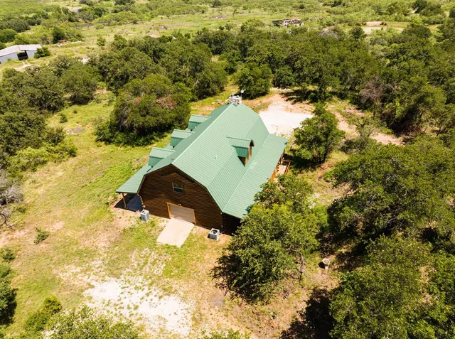 a view of a yard with swimming pool