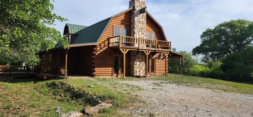 1992 County Road 330 Ranger, TX 76470 - Photo 4 of 40 a view of a house with a yard
