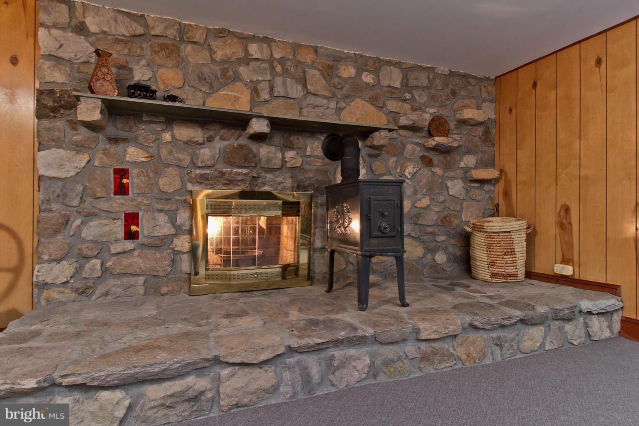 2746 Kaetzel Road Rohrersville, MD 21779 - Photo 22 of 30 Basement has woodburning fireplace & woodstove