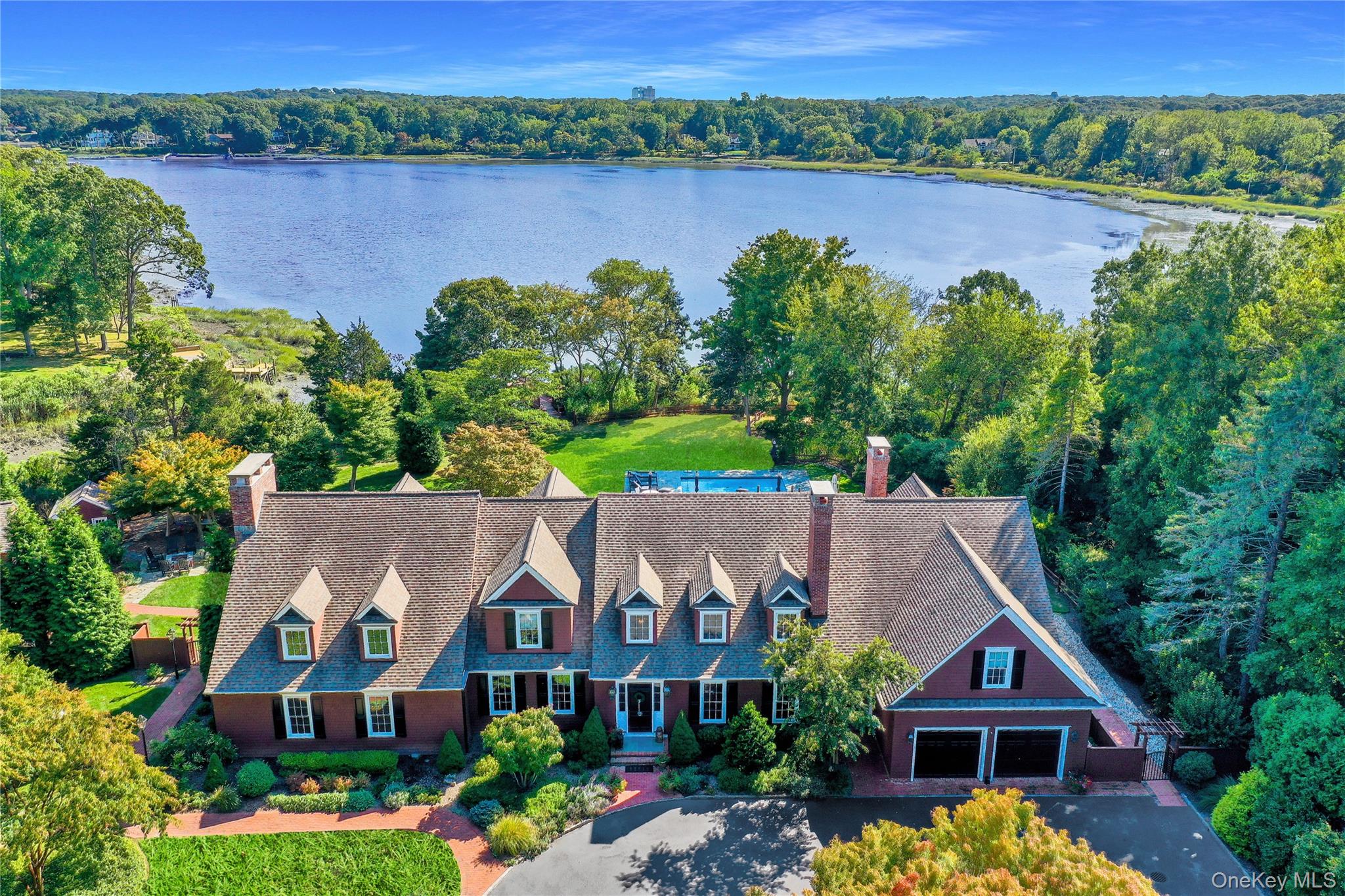 63 Dyke Road Setauket, NY 11733 - Photo 3 of 49 View of subject property with a nearby body of water