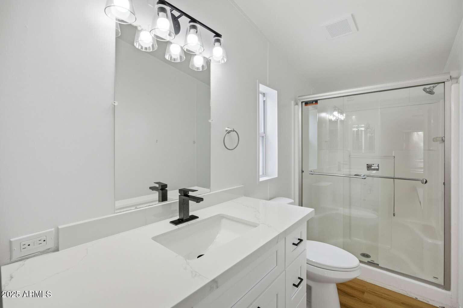 705 East Cherry Street Payson, AZ 85541 - Photo 15 of 35 a bathroom with a sink a toilet and shower