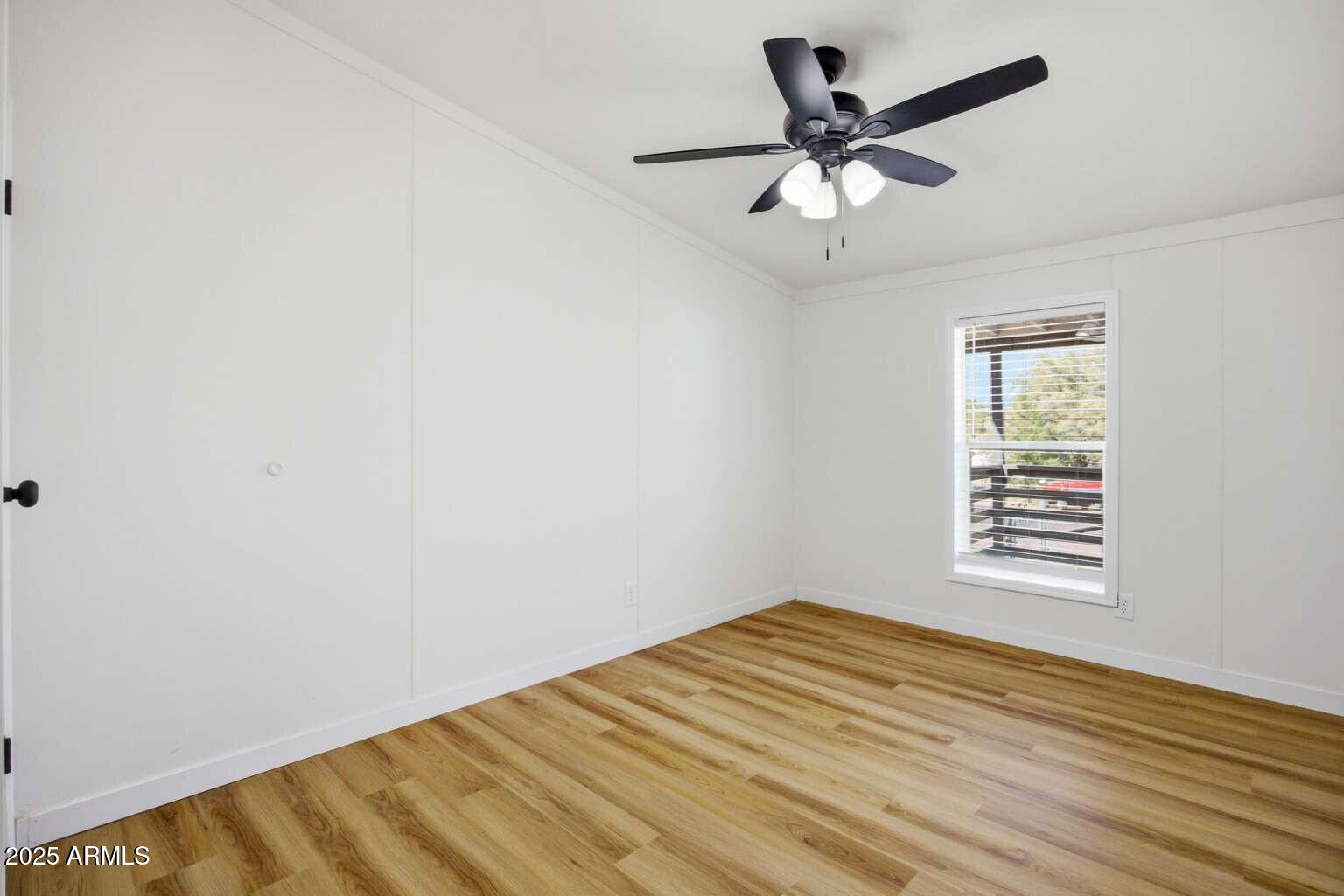 705 East Cherry Street Payson, AZ 85541 - Photo 16 of 35 an empty room with a window and a ceiling fan