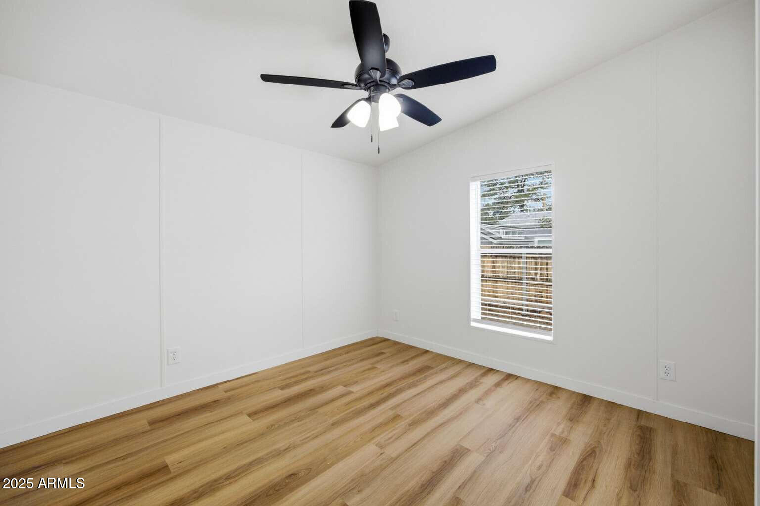 705 East Cherry Street Payson, AZ 85541 - Photo 18 of 35 a view of empty room with wooden floor