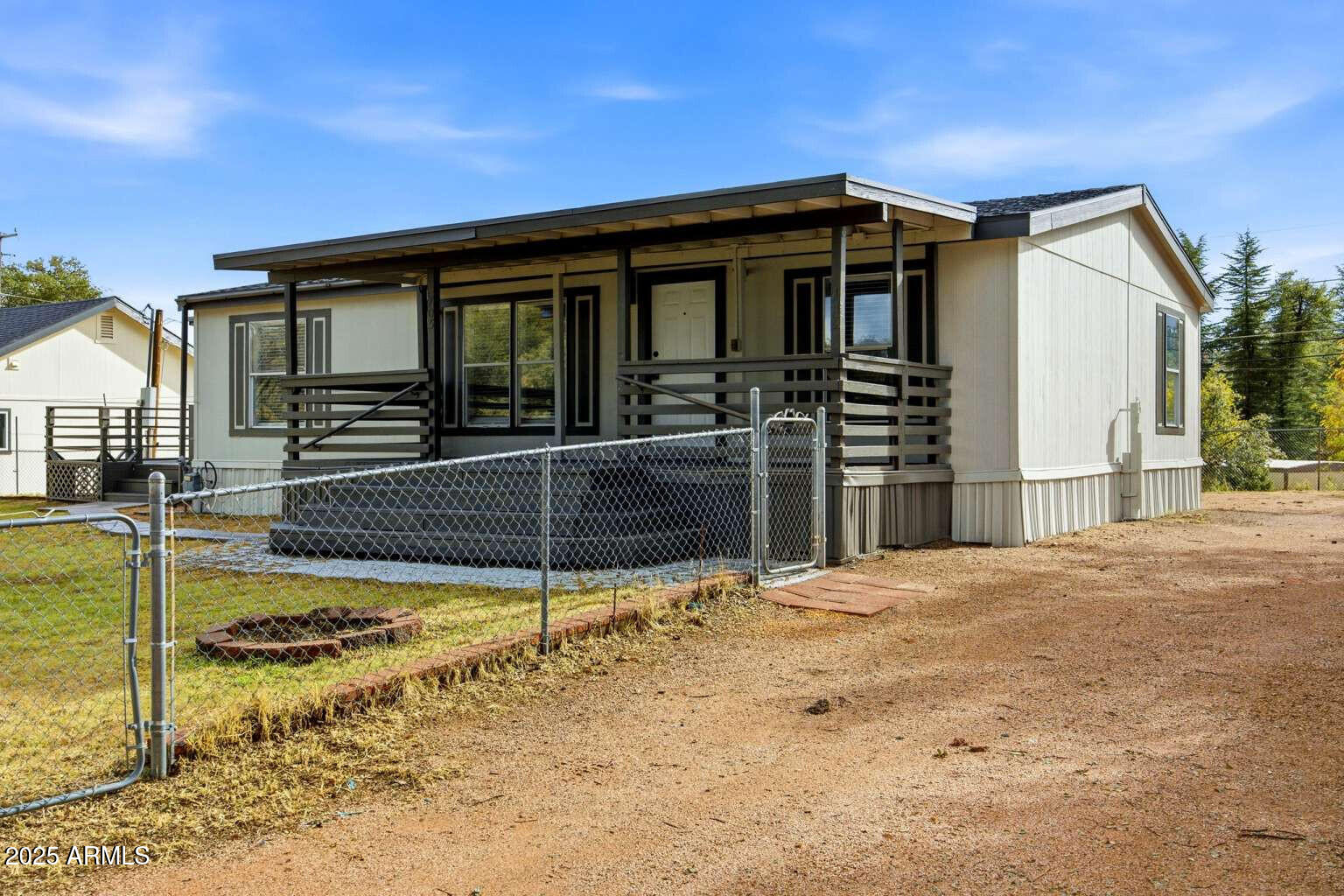 705 East Cherry Street Payson, AZ 85541 - Photo 5 of 35 a front view of a house with a porch