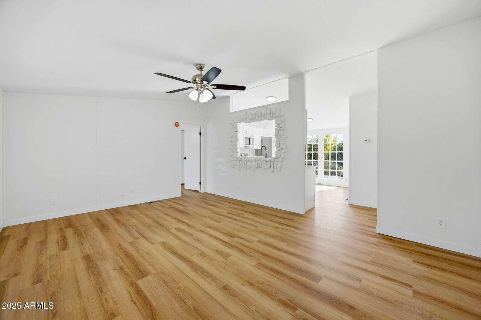 705 East Cherry Street Payson, AZ 85541 - Photo 8 of 35 a view of empty room with wooden floor