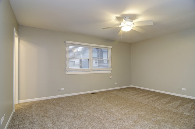 467 Sheffield Road Naperville, IL 60565 - Photo 11 of 19 a view of a room with windows and chandelier fan