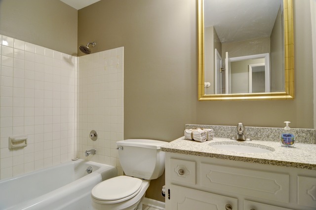 467 Sheffield Road Naperville, IL 60565 - Photo 13 of 19 a bathroom with a granite countertop sink toilet and shower