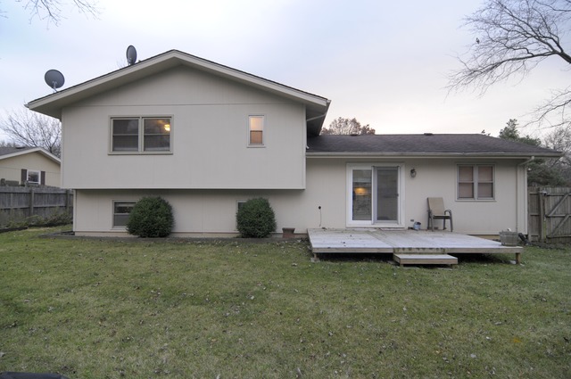 467 Sheffield Road Naperville, IL 60565 - Photo 18 of 19 a front view of a house with a garden and porch