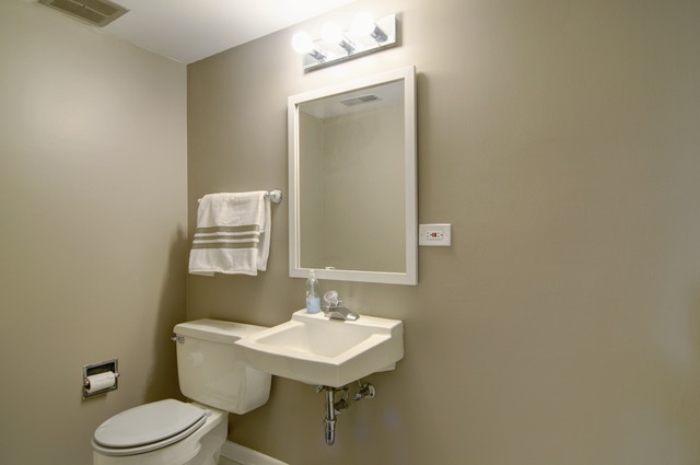 467 Sheffield Road Naperville, IL 60565 - Photo 9 of 19 a bathroom with a sink a toilet and mirror