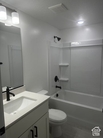80 South Moonlit Road Mapleton, UT 84664 - Photo 17 of 18 Full bath with a textured ceiling, shower / bathtub combination, and vanity