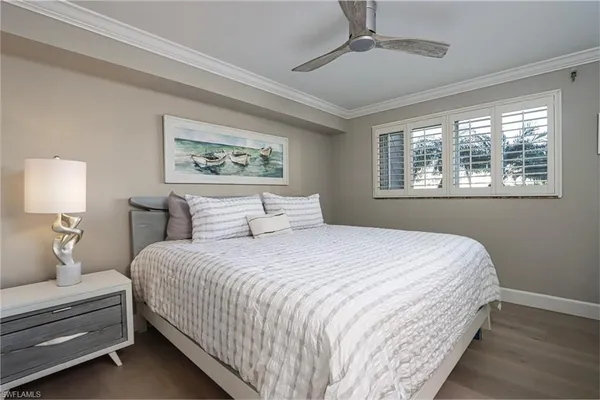 a bedroom with bed and a window