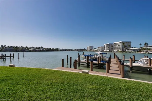 a view of a lake with a bench in front of it