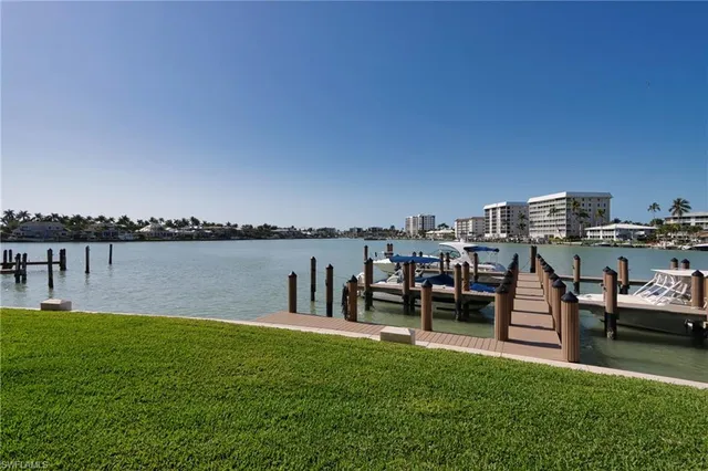 a view of a lake with a bench in front of it