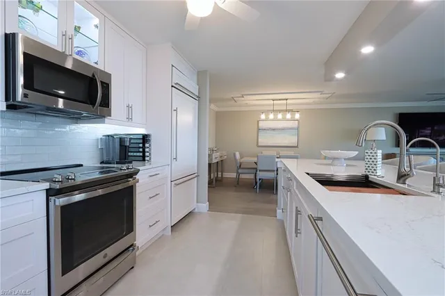a kitchen with a stove and a sink