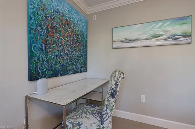 a view of a room with a table and chairs