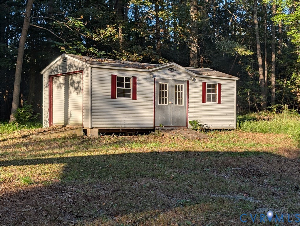 3426 Lake View Road Mechanicsville, VA 23111 - Photo 14 of 18 a front view of a house with a yard