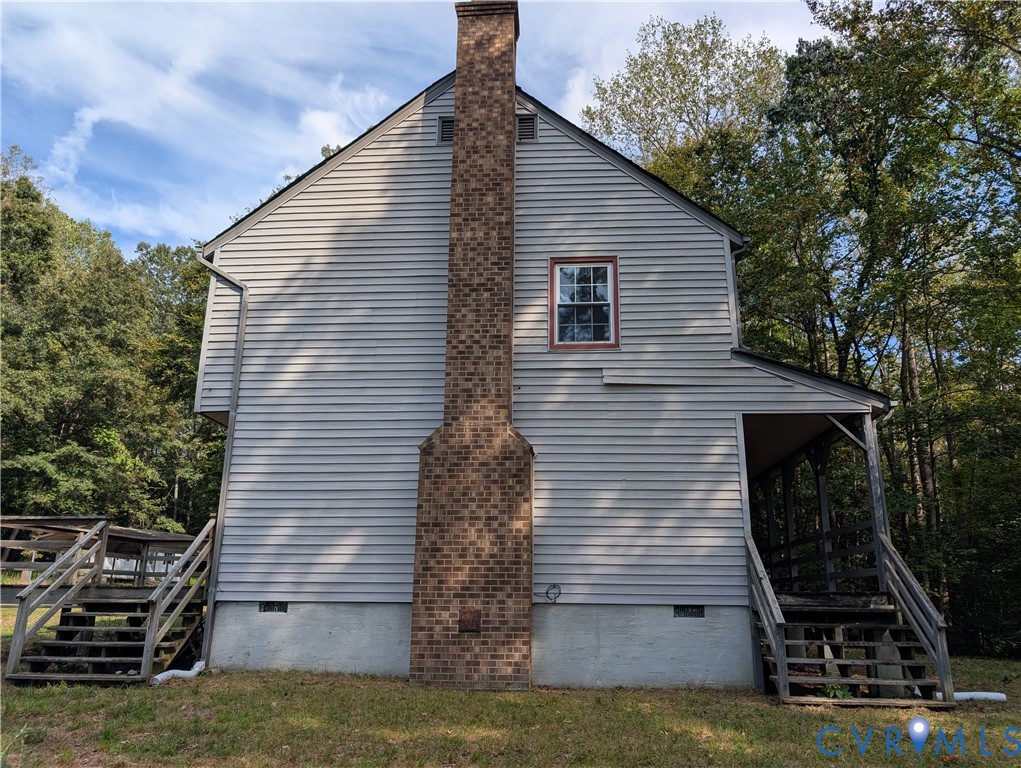 3426 Lake View Road Mechanicsville, VA 23111 - Photo 16 of 18 a view of a house with a yard