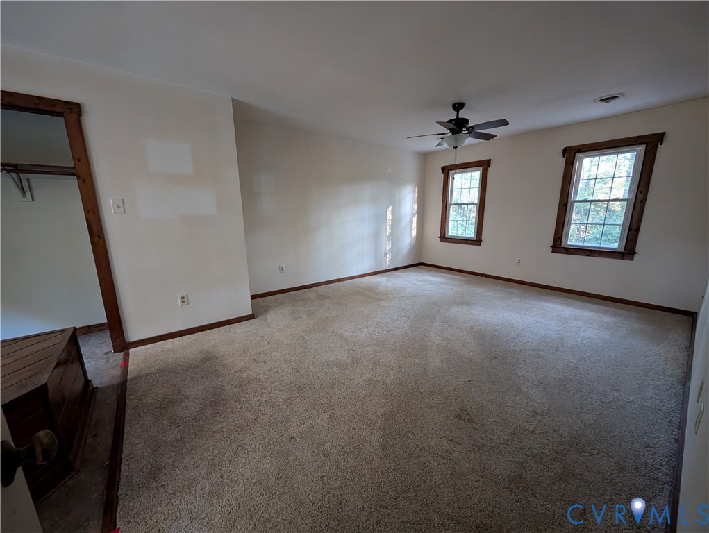 3426 Lake View Road Mechanicsville, VA 23111 - Photo 8 of 18 an empty room with windows and cabinet