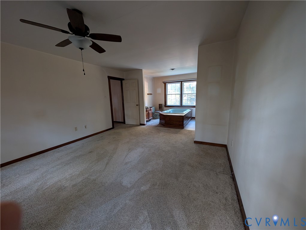 3426 Lake View Road Mechanicsville, VA 23111 - Photo 9 of 18 a view of empty room with a ceiling fan and window