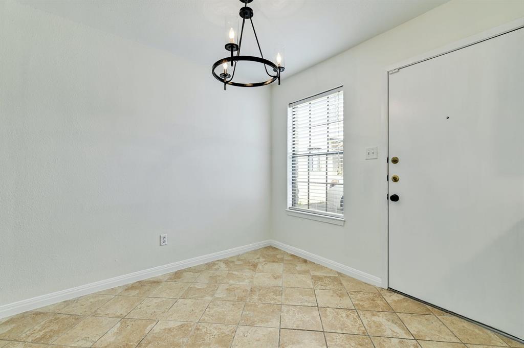204 Northwest Drive, Unit B Round Rock, TX 78664 - Photo 15 of 25 a view of a room with window and chandelier fan