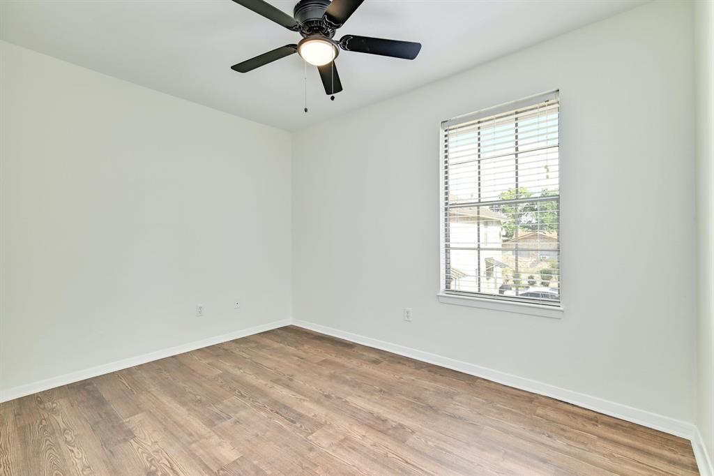 204 Northwest Drive, Unit B Round Rock, TX 78664 - Photo 19 of 25 an empty room with a window and a fan