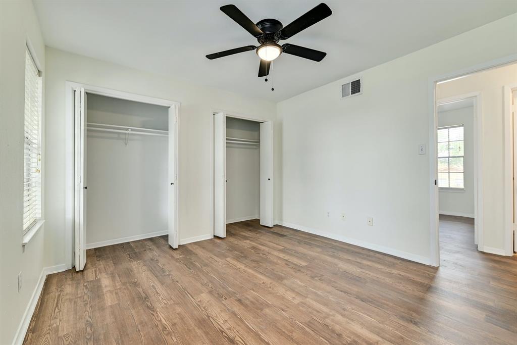 204 Northwest Drive, Unit B Round Rock, TX 78664 - Photo 24 of 25 a view of empty room with wooden floor and ceiling fan