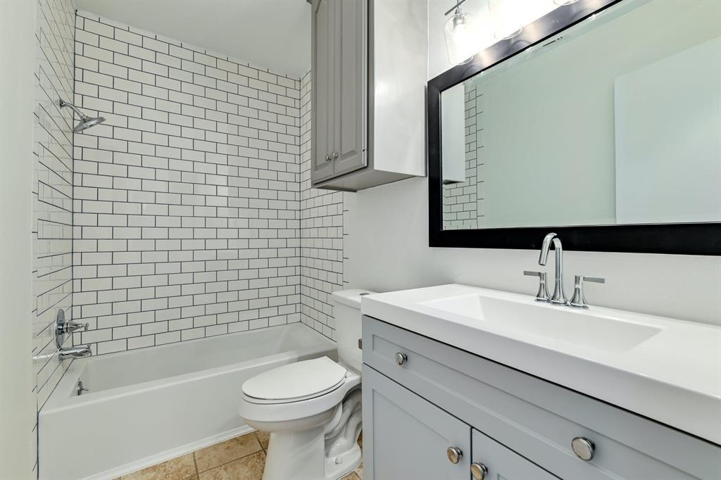 204 Northwest Drive, Unit B Round Rock, TX 78664 - Photo 4 of 25 a bathroom with a sink a toilet and shower