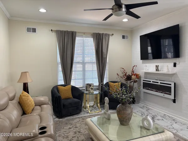 a living room with furniture and a flat screen tv
