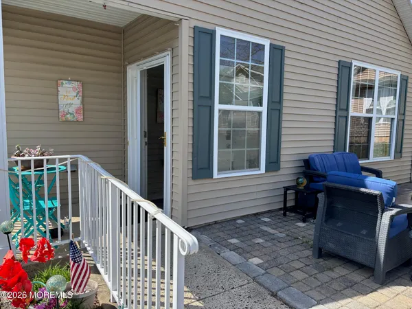 a view of a house with wooden floor and a porch