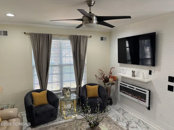 a bedroom with a bed and a lamp on dresser