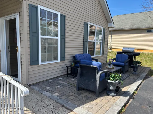 a view of a house with lounge chair and a window