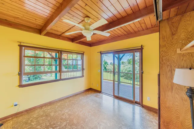 a view of a brick house with a large window
