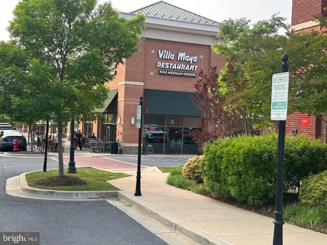 a front view of a building with parking space