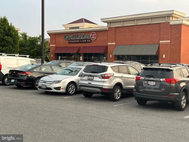 a view of a car parked in front of a house