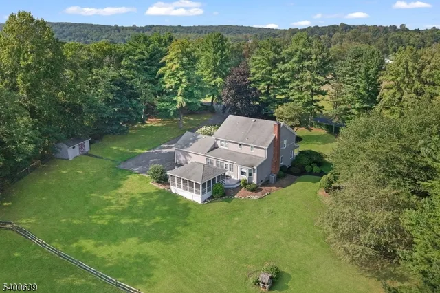 a view of a two chairs in a backyard