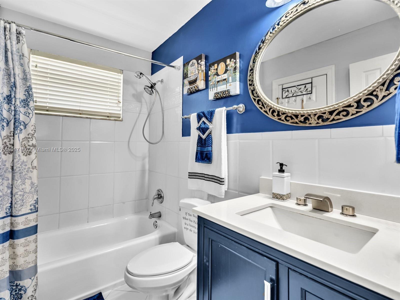 2050 Northwest 89th Avenue, Unit 211 Pembroke Pines, FL 33024 - Photo 11 of 14 a bathroom with a sink a toilet and shower